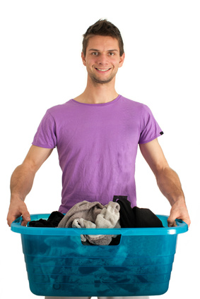 Young man doing the laundry